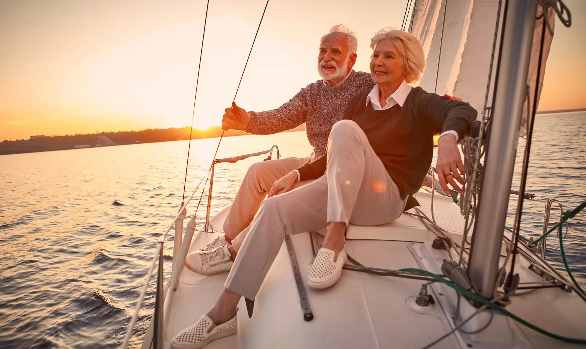 Couple enjoying retirement sailing