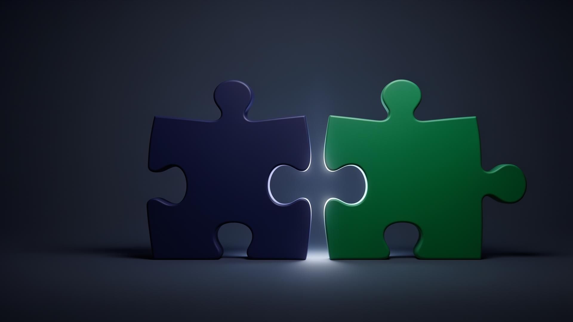 A navy and an emerald jigsaw puzzle piece meeting with a soft glow on a dark gradient background